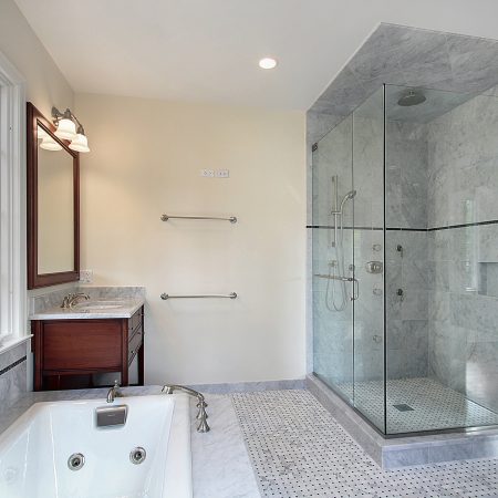 Master bath in new construction home with large glass shower